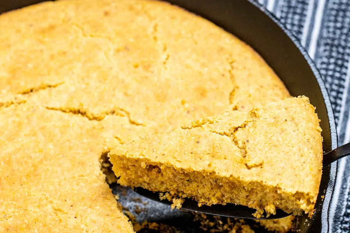 Close-up of the tender, moist crumb of gluten-free cornbread